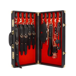 Luxury BDSM Briefcase with 12-piece full-grain leather bondage set, including collar, cuffs, ball gag, and more for sophisticated restraint play.