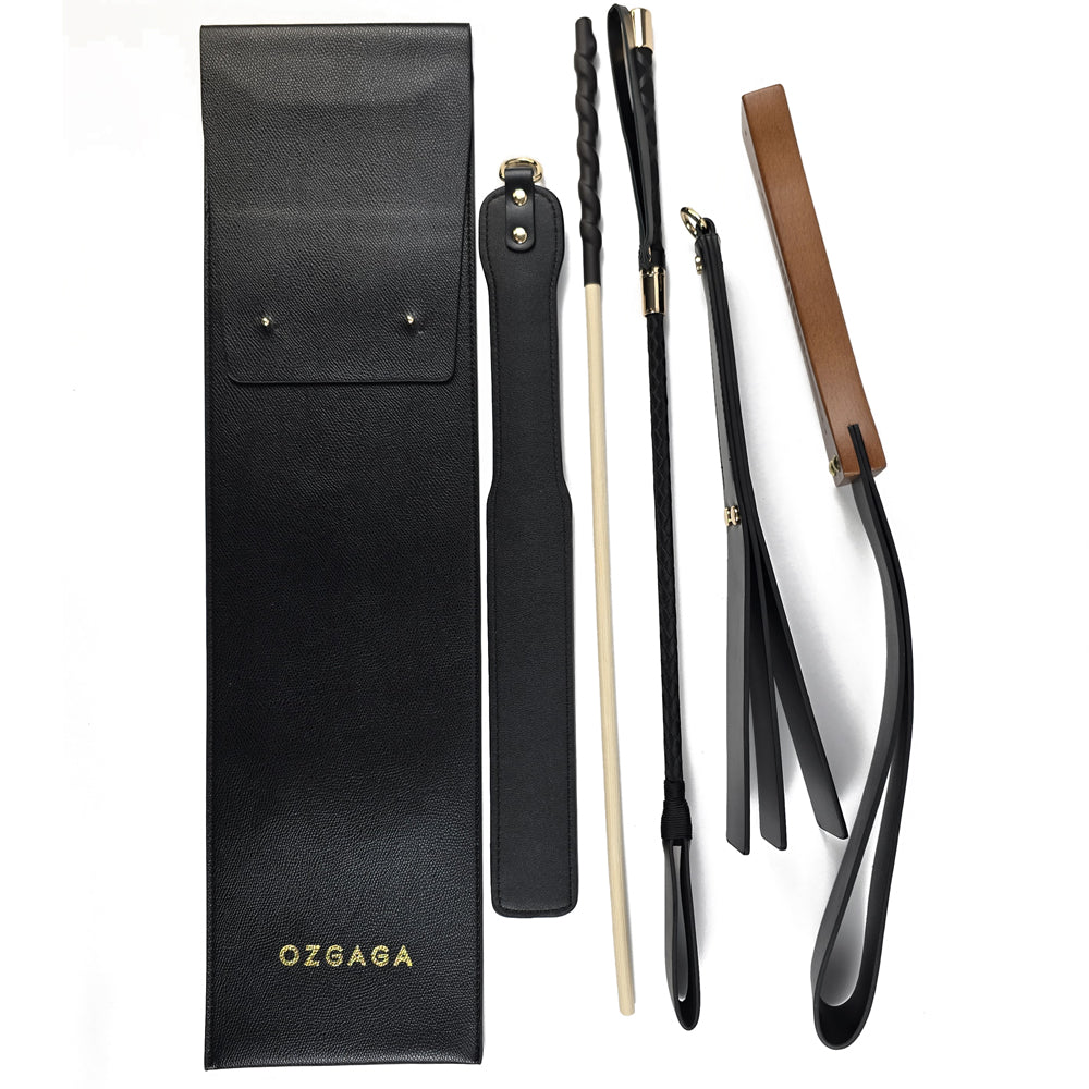 Deluxe BDSM Punisher Spanking Kit featuring impact play tools including a riding crop, spanking cane, leather paddle ruler, triple-layered spanking paddle, and a wooden-handle leather paddle, displayed with a black leather storage bag.