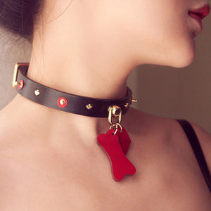 Doggy Bone Choker with Leash Set made from genuine cowhide leather, featuring a dog bone and heart design, paired with a gold metallic chain leash for BDSM play