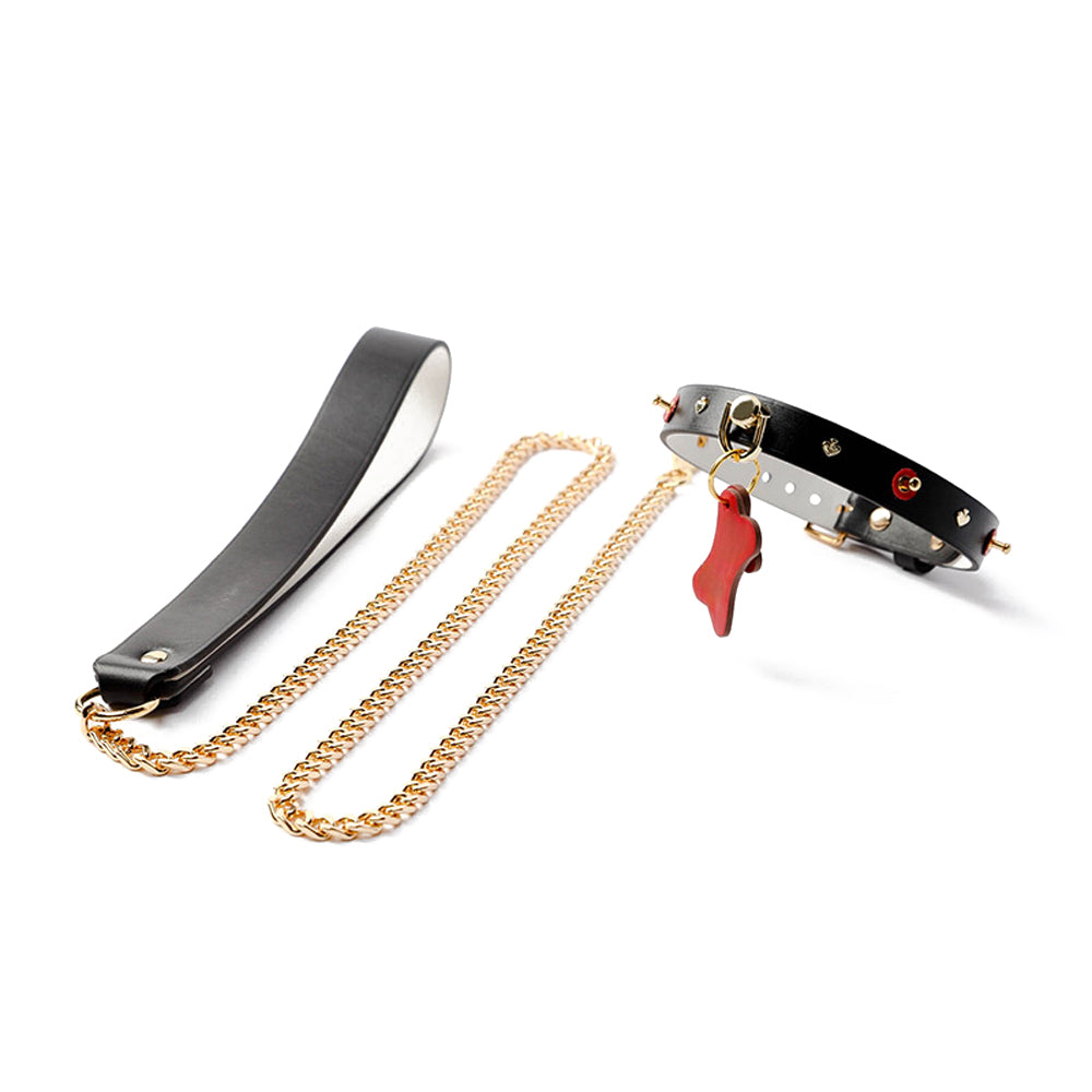 Doggy Bone Choker with Leash Set made from genuine cowhide leather, featuring a dog bone and heart design, paired with a gold metallic chain leash for BDSM play