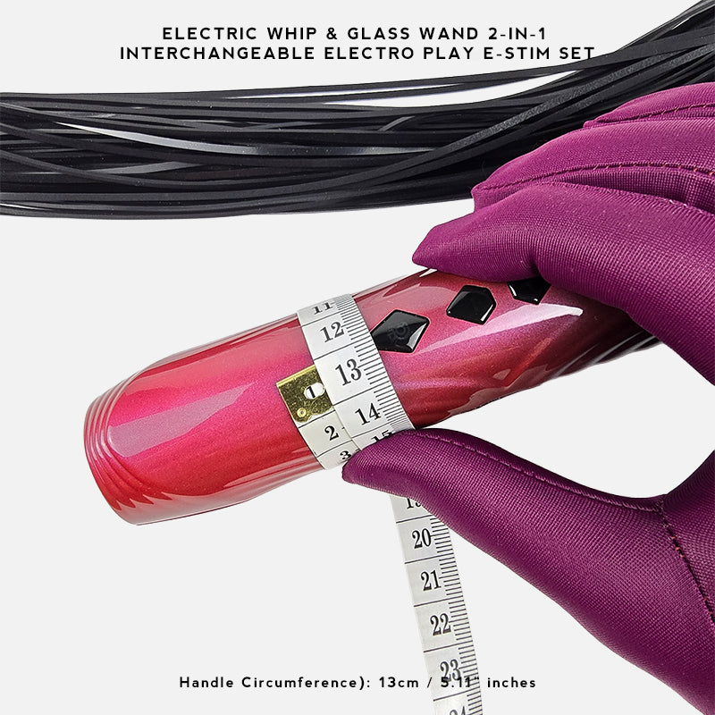 A close-up of a pink electric wand massager being measured with a tape measure, held by a hand wearing a purple glove. Black and purple interchangeable wand parts are shown above, with text reading 'ELECTRIC WHIP & GLASS WAND 2-IN-1 INTERCHANGEABLE ELECTRO PLAY E-STIM SET' and 'Handle Circumference): 13cm / 5.