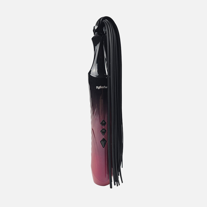An electric whip and glass wand 2-in-1 interchangeable electro play e-stim set, featuring a metallic pink-to-black gradient handle with a long black tassel, shown on a light gray background with text at the top.