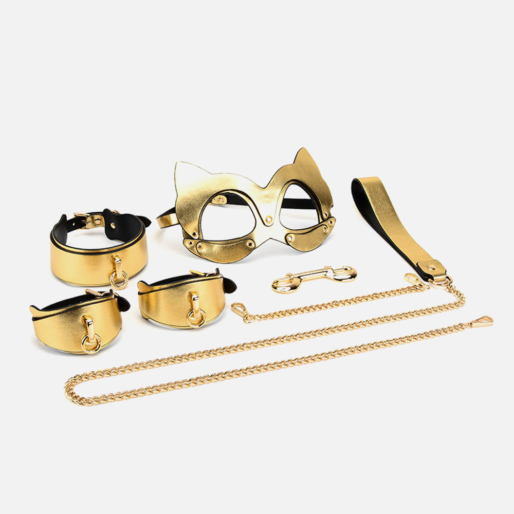 Gold cat-eye glasses and accessories on a white background