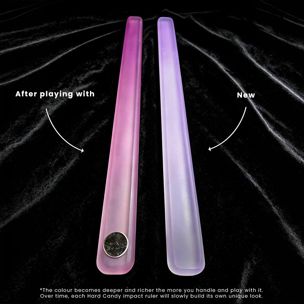 Two translucent hard candy impact rulers, one pink and one lavender, displayed on a black textured background with text explaining that the color deepens over time with use.