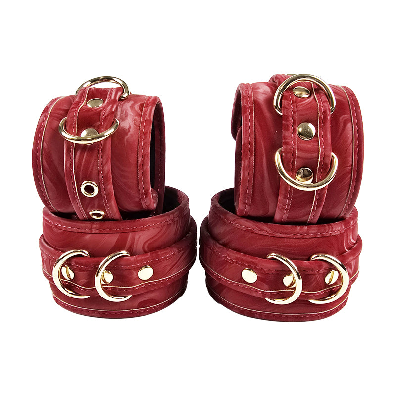 OZGAGA Deluxe Red Passion Velvet Bondage Restraint Spanking Kit (15pc) Red leather cuffs with gold hardware on a white background