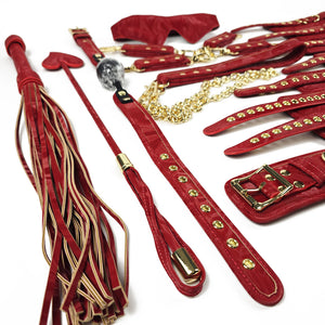 Red leather bondage set with gold accents on a white background. OZGAGA Deluxe Red Passion Velvet Bondage Restraint Spanking Kit (15pc)