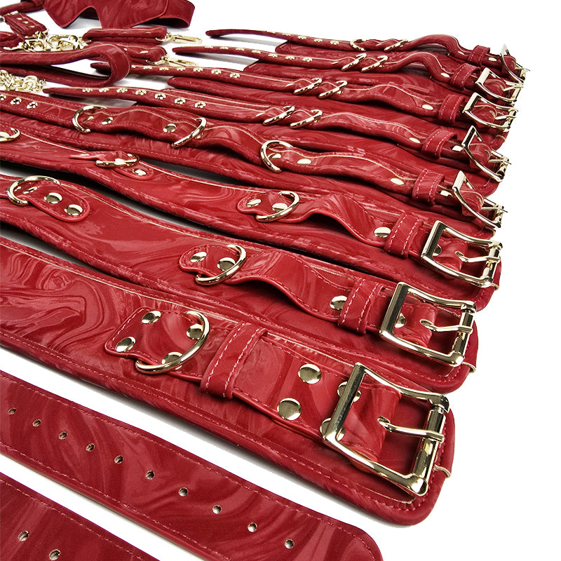 Multiple red leather belts with gold buckles on a white background. OZGAGA Deluxe Red Passion Velvet Bondage Restraint Spanking Kit (15pc)
