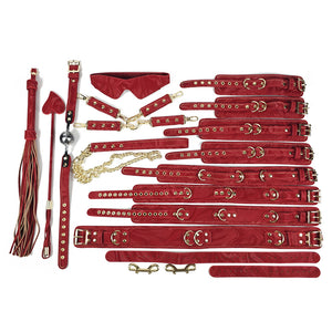 Collection of red leather bondage accessories on a white background. OZGAGA Deluxe Red Passion Velvet Bondage Restraint Spanking Kit (15pc)