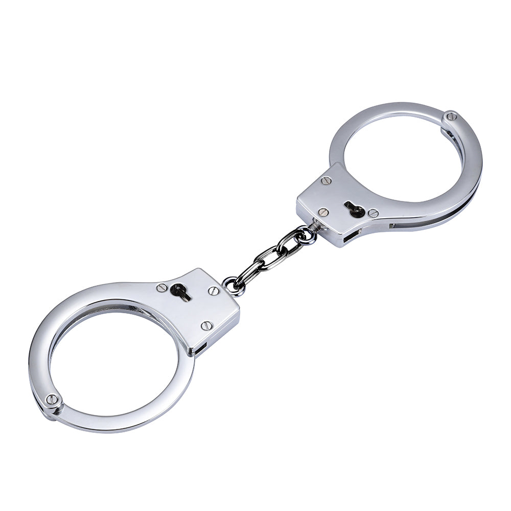 Silver stainless steel handcuffs with safety release and keys, designed for BDSM play, featuring a sleek and durable design.