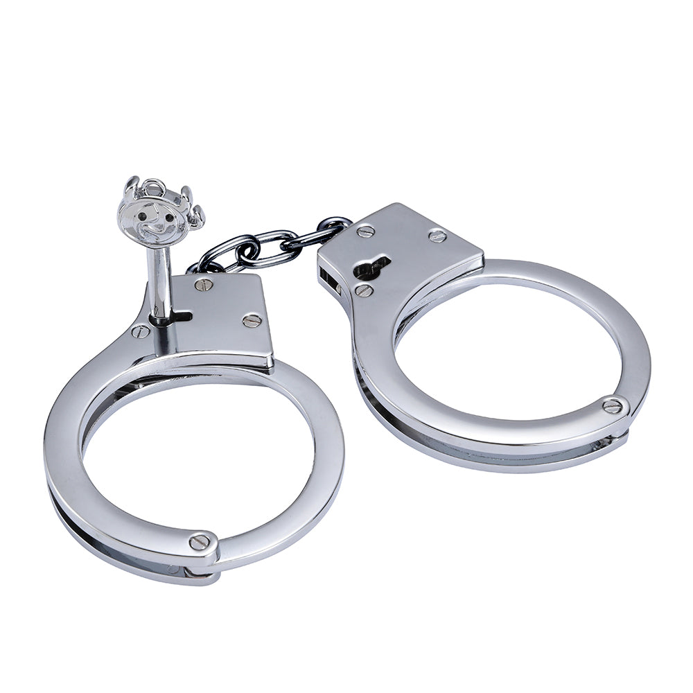 Silver stainless steel handcuffs with safety release and keys, designed for BDSM play, featuring a sleek and durable design.