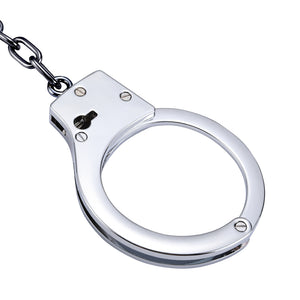 Silver stainless steel handcuffs with safety release and keys, designed for BDSM play, featuring a sleek and durable design.