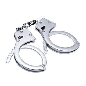 Silver stainless steel handcuffs with safety release and keys, designed for BDSM play, featuring a sleek and durable design.