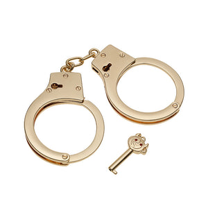 Gold stainless steel handcuffs with safety release and keys, designed for BDSM play, featuring a sleek and durable design.