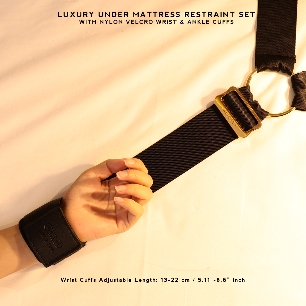 Luxury BDSM Under Mattress Restraint Set with black nylon straps and golden hardware, designed for full-body restraint play on any bed.