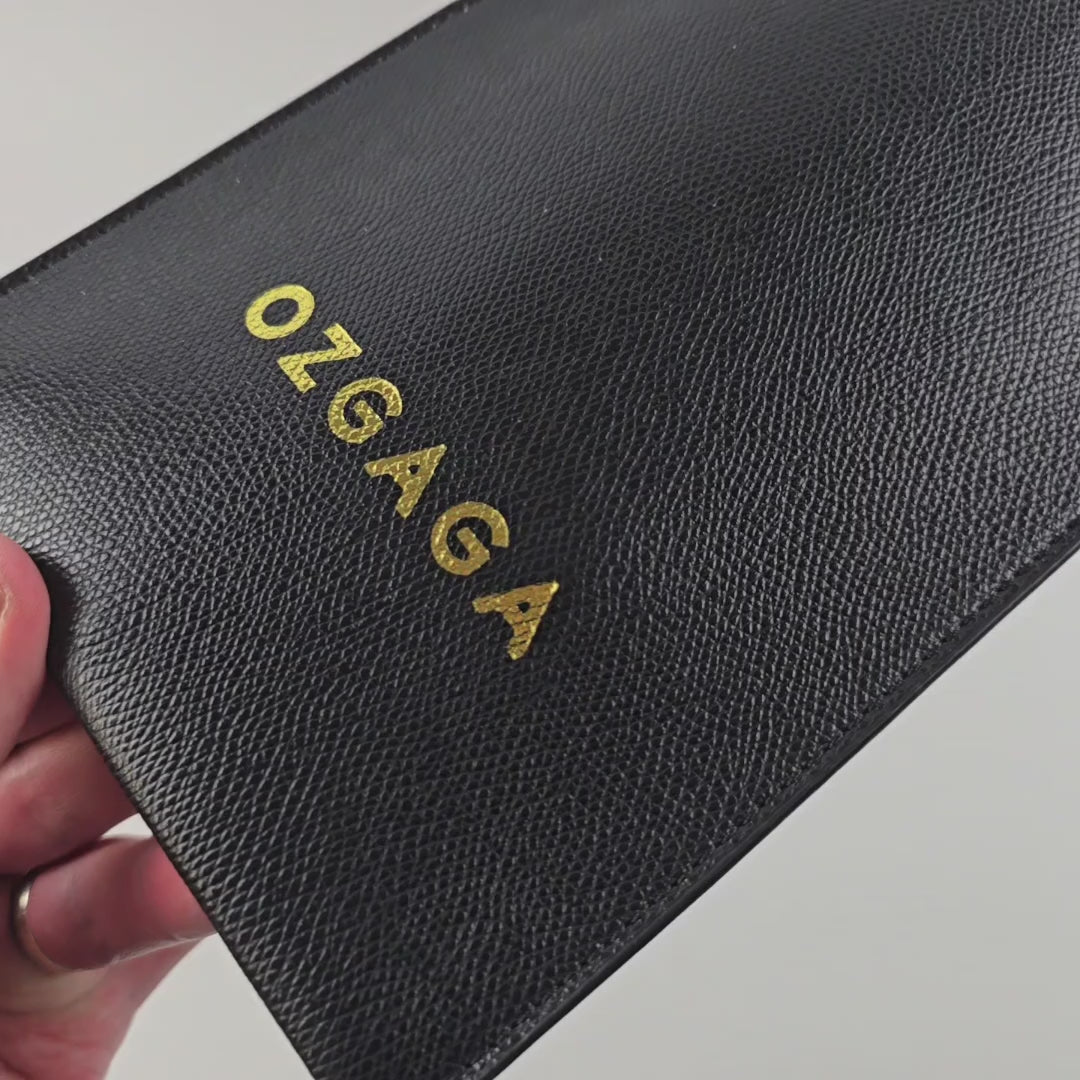 Deluxe BDSM Punisher Spanking Kit featuring impact play tools including a riding crop, spanking cane, leather paddle ruler, triple-layered spanking paddle, and a wooden-handle leather paddle, displayed with a black leather storage bag.