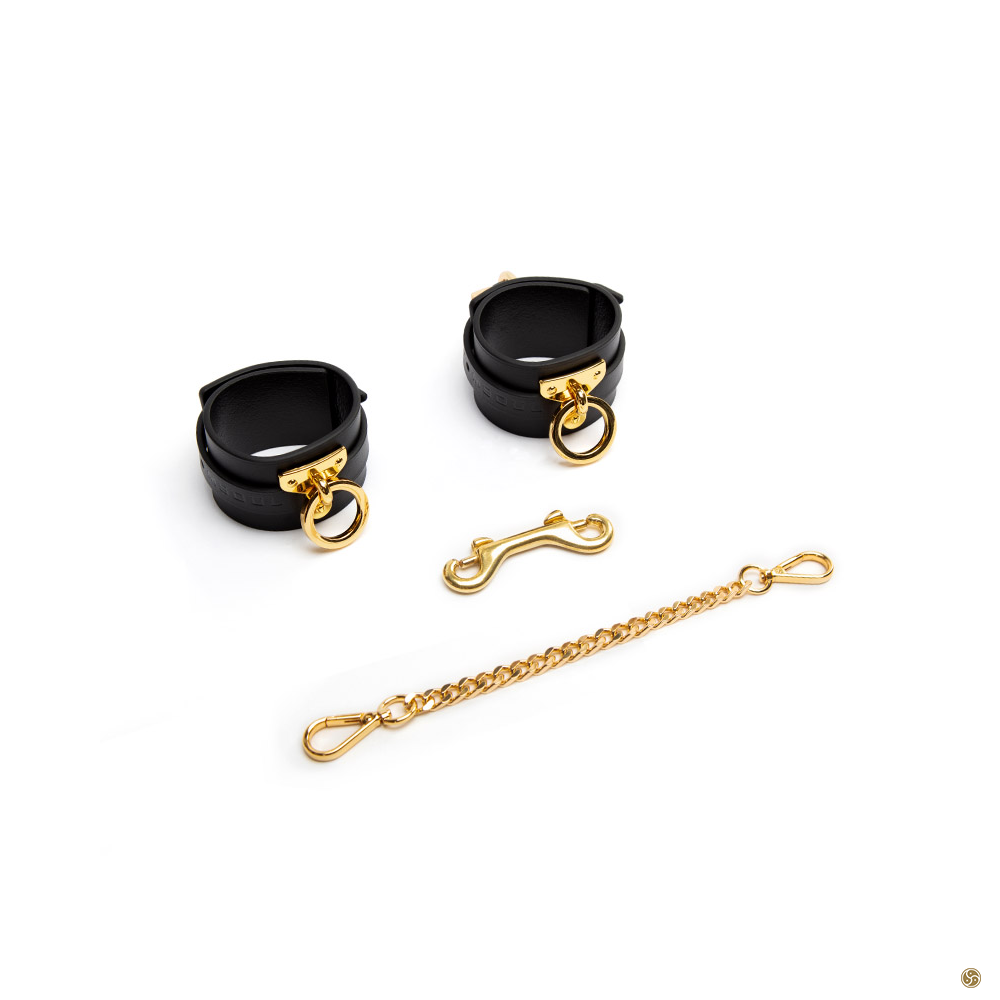 BDSM HANDCUFFS - Black leather ankle cuffs with gold ring